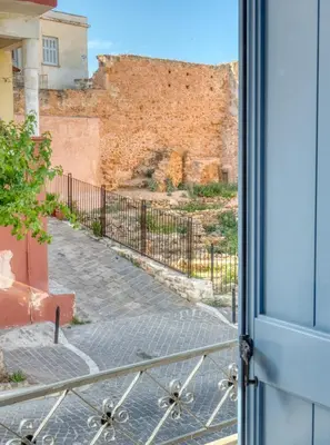an open door with a view of a brick wall at Il Porto Blu in Chania Town