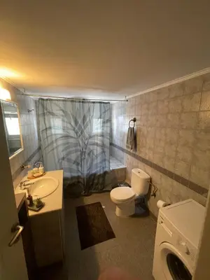 a bathroom with a toilet and a sink and a shower at Tzitzifianaki apartment in Chania Town