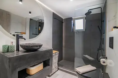 a bathroom with a sink and a shower at Casa Moca in Chania Town
