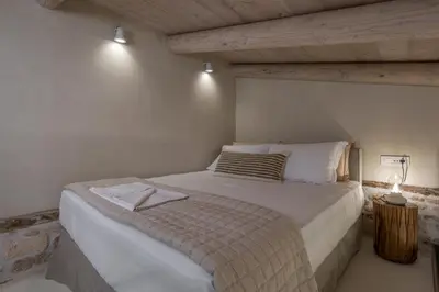a bedroom with a large bed in a room at il Campanile Luxury Living in Chania Town
