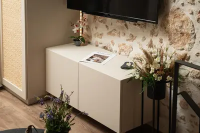 a white refrigerator in a room with flowers at Lovelia Maisonette Chania in Chania Town
