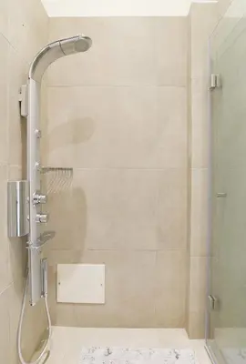 a shower with a glass door in a bathroom at Helios studio next to the sea BY APOKORONAS-VILLAS in Kalyves