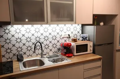 a kitchen with a sink and a microwave at Kabanas suite 1 in Chania Town