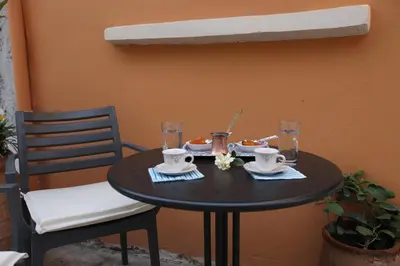 a black table with a plate of food on it at Kabanas suite 1 in Chania Town