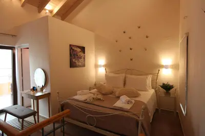 a bedroom with a bed in a room at Kabanas 2 luxury Suite in Chania Town