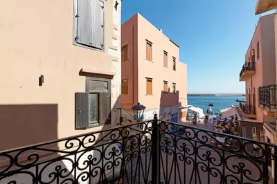 a view of the ocean from a balcony of a building at Filomeli Estate in Chania Town