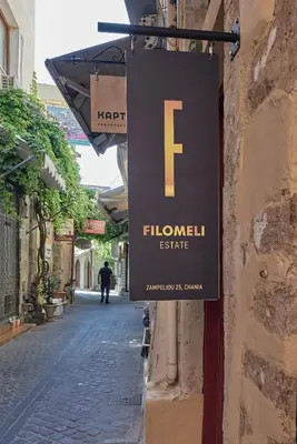 a sign on the side of a building on a street at Filomeli Estate in Chania Town