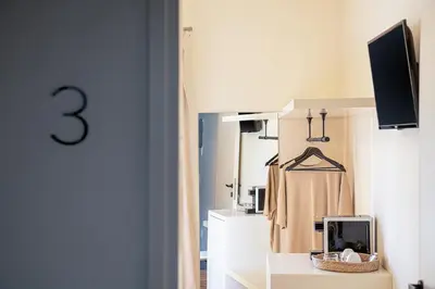 a dressing room with a mirror and a closet at Faedra Residence in Chania Town