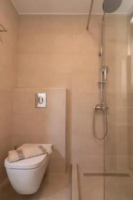 a bathroom with a toilet and a shower at Gemma Apartments in Palaiochóra