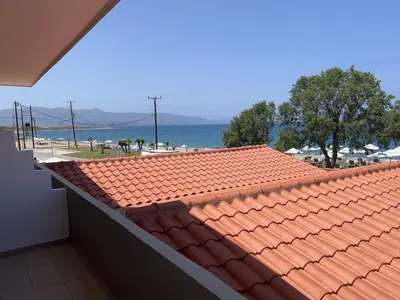 a view of the ocean from the roof of a building at wave rooms sea view in Maleme