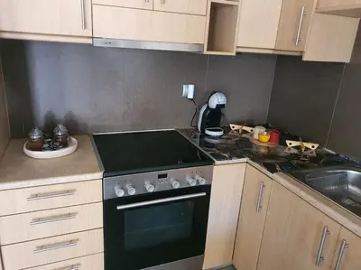 a kitchen with a stove and a sink at Korais apartment, Chania Crete in Kounoupidhianá