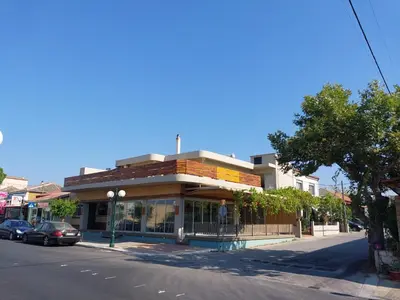 a building on the side of a street at Passatempo Casa - 3 bedroom apartment close to the swimming pool in Gerani Chanion