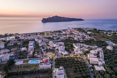 an aerial view of a city and the ocean at Megalith Villas in Agia Marina Nea Kydonias