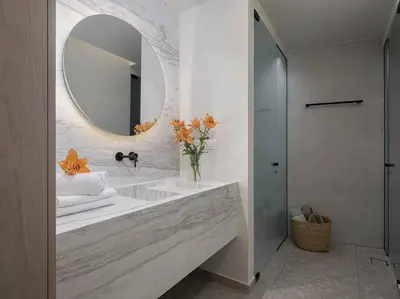 a bathroom with a sink and a mirror at Ares Luxurious Residence in Kolymvari