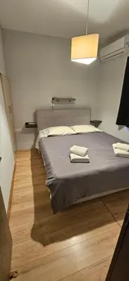 a bedroom with a bed with two towels on it at 4Seasons in Chania Town