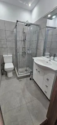 a bathroom with a shower and a toilet and a sink at 4Seasons in Chania Town
