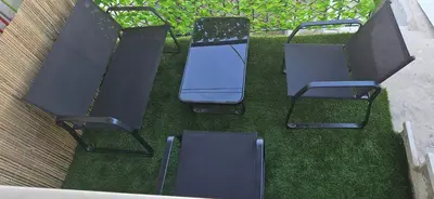 a group of chairs sitting on the grass at 4Seasons in Chania Town