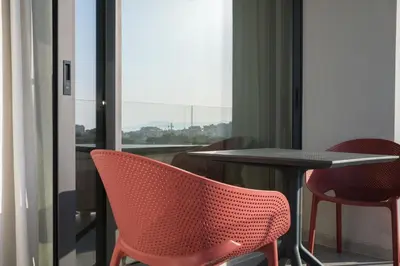 a room with a table and chairs and a window at Sky-High Central Penthouse w. Stunning Views - 03 in Chania Town