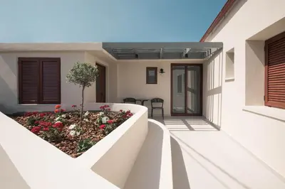a house with a garden on the side of it at Villa Methexis in Arménoi
