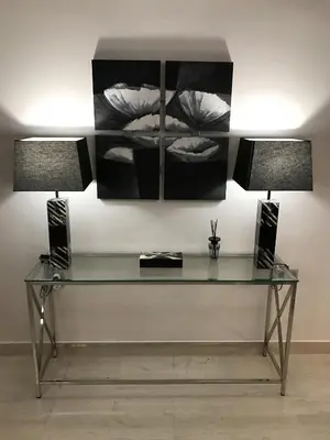 a glass desk with two lamps in a room at Maria's Cozy Chania Apartment in Chania Town