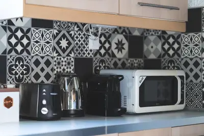 a kitchen counter with a microwave on a counter top at Labyrinth. The Wild life of Crete in Katsifarianá