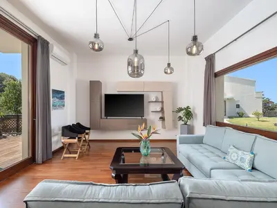 a living room with a couch and a table at Villa Magia in Stérnai