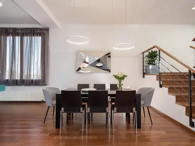 a dining room with a table and chairs at Villa Magia in Stérnai