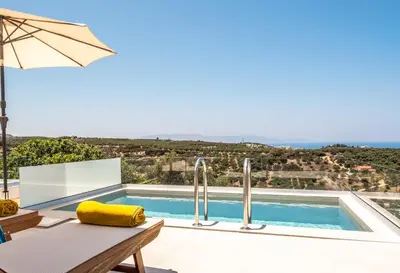 a villa with a swimming pool with a view at Evora Suites in Chania Town