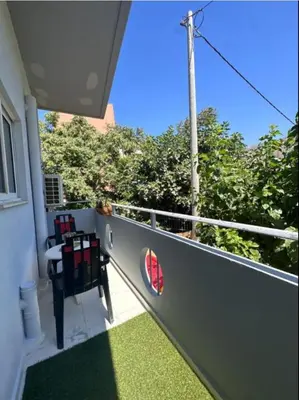a balcony of a house with a view of trees at Nova Marine in Souda