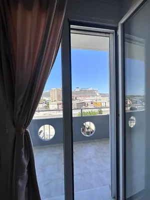 a glass door with a view of a balcony at Nova Marine in Souda
