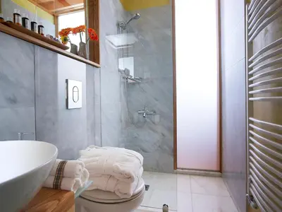 a bathroom with a sink and a toilet and a shower at Dorotheou House in Chania Town