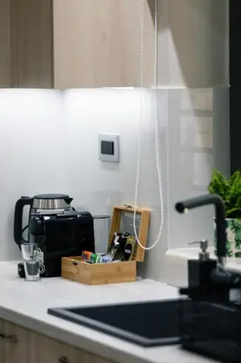 a kitchen counter top with a sink and a counter sidx sidx at Estia Comfort House in Chania Town