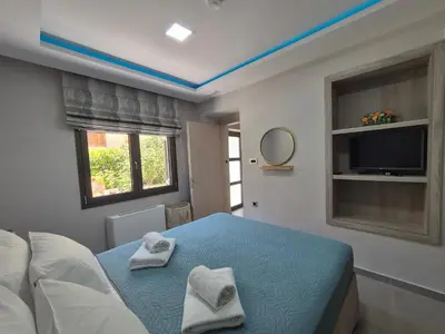 a bedroom with a bed with two towels on it at Estia Comfort House in Chania Town