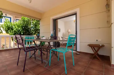 a dining room with a table and chairs at Marika Seaside Villa in Yialós