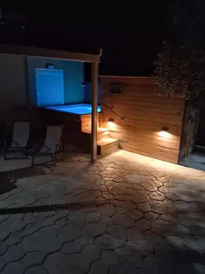 a bed with lights on a patio at night at Elia House in Chania Town
