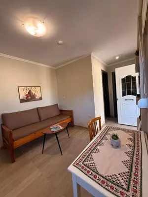 a living room with a couch and a table at Elia House in Chania Town