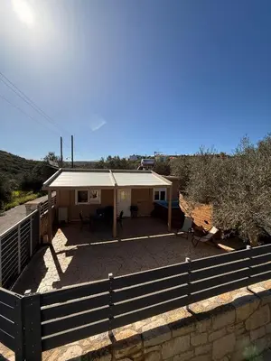 a house with a fence in front of it at Elia House in Chania Town