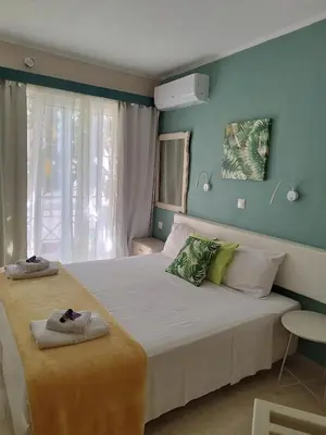 a bedroom with two beds with towels on them at Villa Katerina in Chania Town
