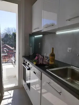 a kitchen with a sink and a counter with a window at Villa Katerina in Chania Town