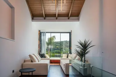 a living room with a couch and a table at Casa del Balo in Gavalomoúrion