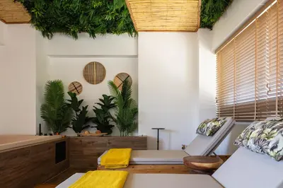 a living room with plants on the wall at JW luxury apartment in Chania Town