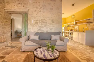 a living room with a couch and a table at Mourelo Home in Gavalochori