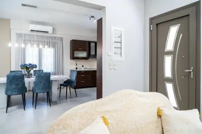 a bedroom with a table and chairs and a dining room at Villa Emily in countryside in Chania Town
