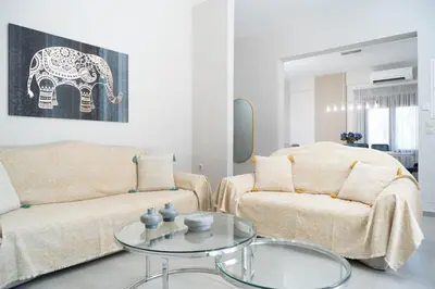 a living room with a couch and a table at Villa Emily in countryside in Chania Town