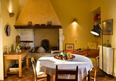 a kitchen with a table with a bowl of fruit on it at Dorothy's Dream in Chania Town