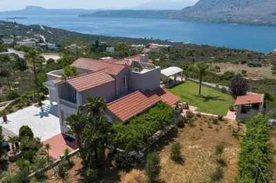 an aerial view of a house with a view of the ocean at Villa Damant in Pithárion