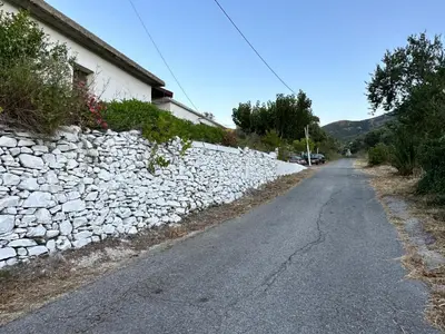 a stone wall on the side of a road at Anastasia Country Home in Strovlés