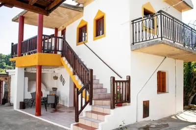 a house with stairs and balconies on it at Anastasia Country Home in Strovlés