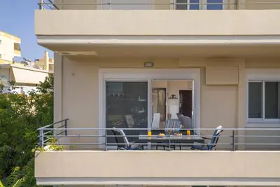 a balcony of a house with a table and chairs at Casa Del Sol-Halepa- in Chania Town