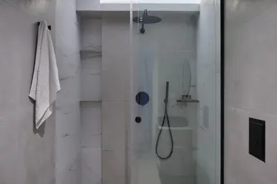 a shower with a glass door in a bathroom at Kyamon Luxury Villa with Heated Saltwater Pool Near Chania in Chania Town